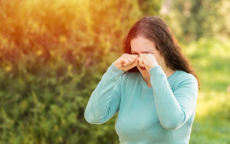 Woman Suffering From Eye Allergies